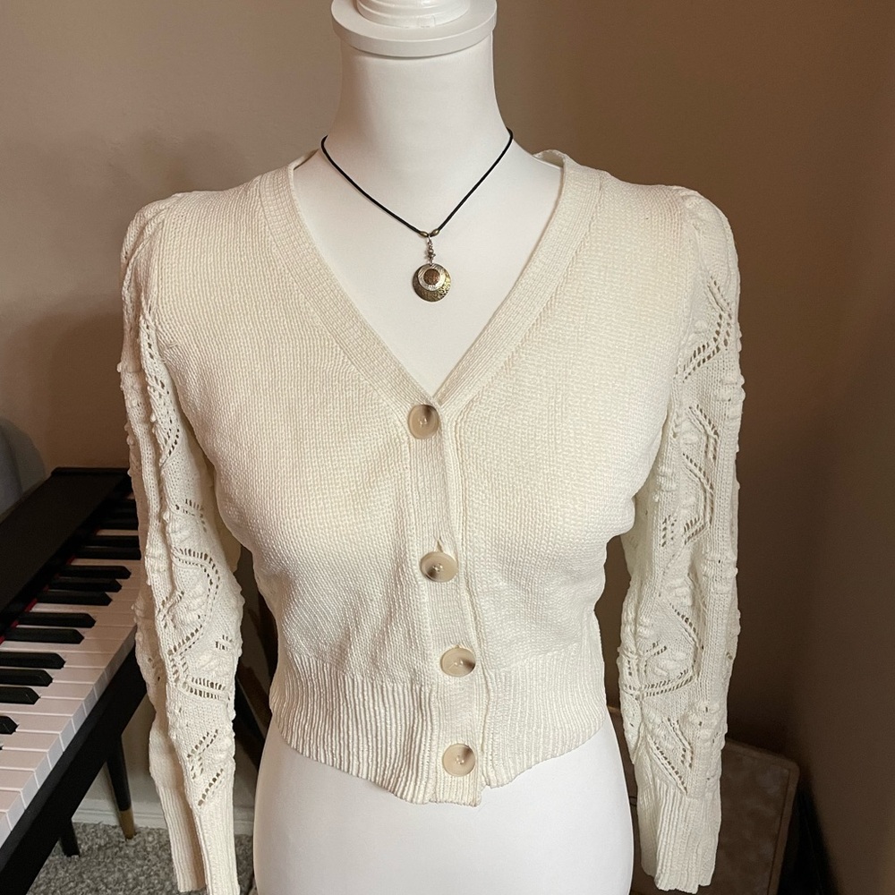 Cream knitted cropped cardigan with buttons. Brand is Jessica Simpson